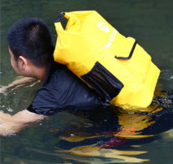 water hiking and swimming with a backpack